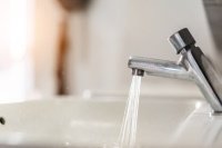 Close up of water tap with wash basin